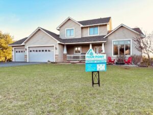 Two-story Twin Cities home with a new roof installed by Four Point Construction